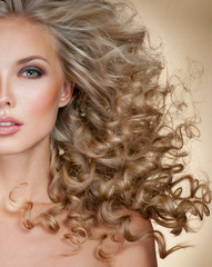 Beautiful blonde woman. Healthy Long Blond Hair. Curly Hair.   B - 122150381