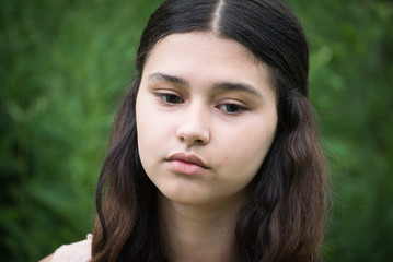 Portrait of beautiful girl looking to the down