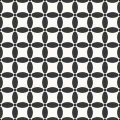 seamless monochrome circle grid pattern of ovals and dots.