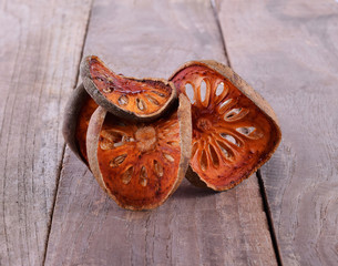 Dried quince on wooden background