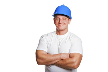 Portriat of man with helmet, worker white shirt. Crossed arms.