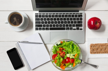 Healthy business lunch snack in office, vegetable salad top view