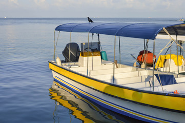 Colorful boat at the pier of the little Garifuna town of Livingston, Cuatemala. Central America