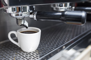 Fototapeta na wymiar cup of coffee with professional coffee machine