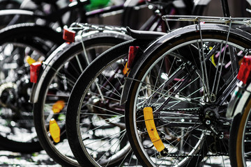 Fototapeta na wymiar Bicycles parking in big european city, summer day