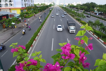 city street with many vehicle in vietnam
