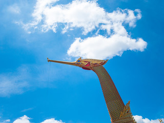 Golden Swan Boat and Temple with Blue Sky