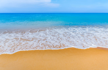 Fototapeta na wymiar white soft wave on the beach and blue sea 