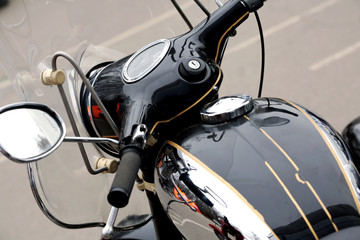 Obraz premium A fragment of a classic motorcycle with elements of chrome