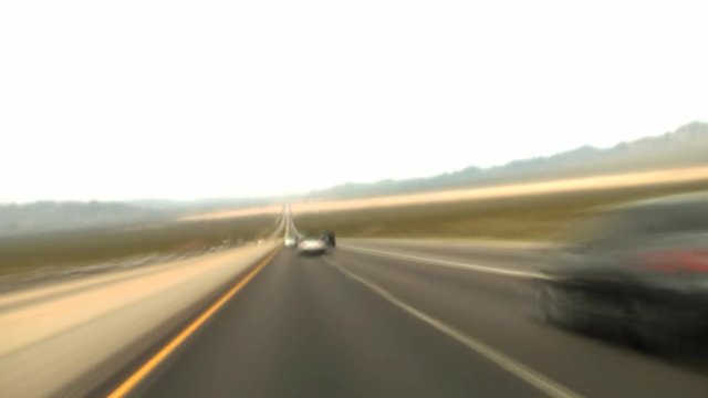 A time lapse speeding down a desert highway.