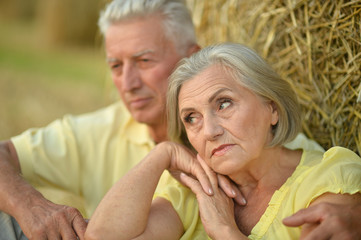 senior couple in summer field