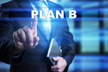 Businessman is pressing button on touch screen interface and selecting "Plan B". Business concept.