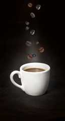 cup of coffee with coffee beans