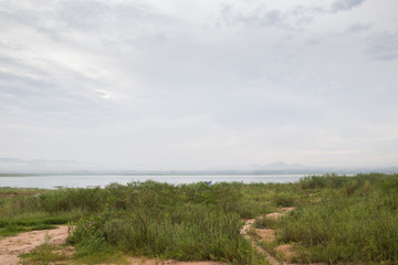 Mountain lake fog before sunrise
