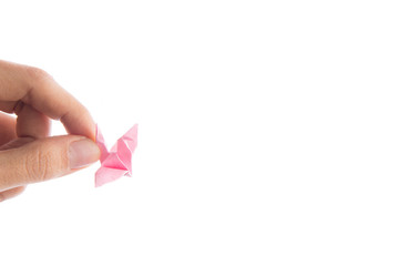 Woman hand taking bird paper origami