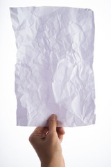 Hand's holding crumpled paper