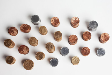Piles of brazilian coins (money) on white background