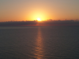 Beautiful Sunrise over a Ocean with reflections on the water