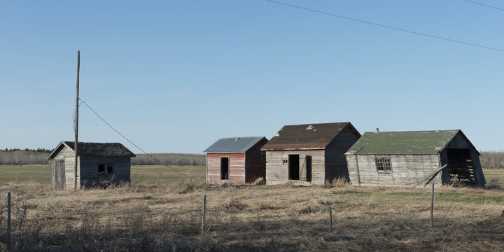 Old abandoned buildings in a field, Manitoba, Canada