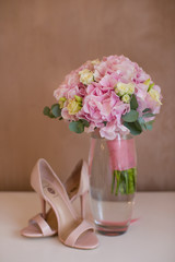 Wedding bouquet and bride's shoes