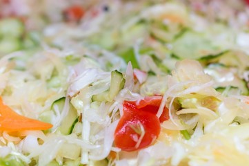 Mixed salad with cabbage and fresh vegetables background