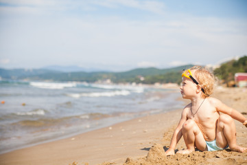 Cute little girl playing on the beach