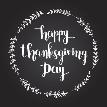 Happy Thanksgiving Day hand lettering text with flower wreath on black background. Calligraphy design. Vector Illustration.