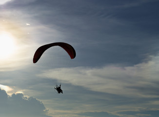 Extrem fly sport silhouette wih sunlight blue sky.