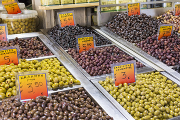 Olives and olive oil for sale at a market for farm products.