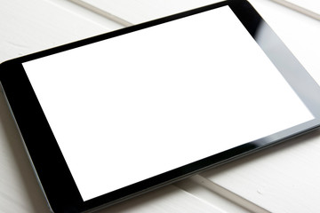 generic tablet pc on top of wooden table
