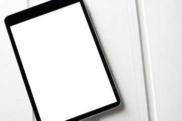 generic tablet pc on top of wooden table