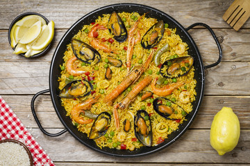 Spanish paella on a wooden table