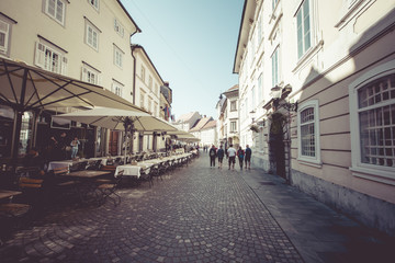 Fototapeta na wymiar Beautiful street in old city centre near the city hall in Ljubljana. 