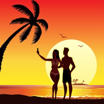 selfie makes lovers on the beach, sunset