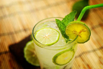 Kaffir lime, Bergamot soda Cool drink , Herb for Treatment of Acid Reflux, with Earth tone background