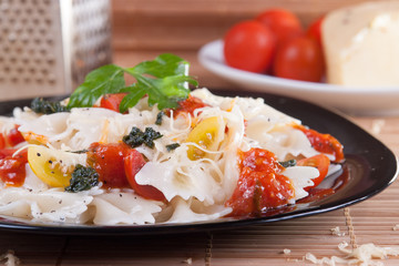 Farfalle Pasta with fresh cherry tomatoes, pesto and red sauce