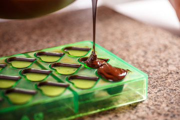 Pouring chocolate in mold