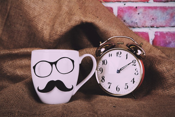 Coffee cup with a black hipster mustache  Vintage Retro Filter.
