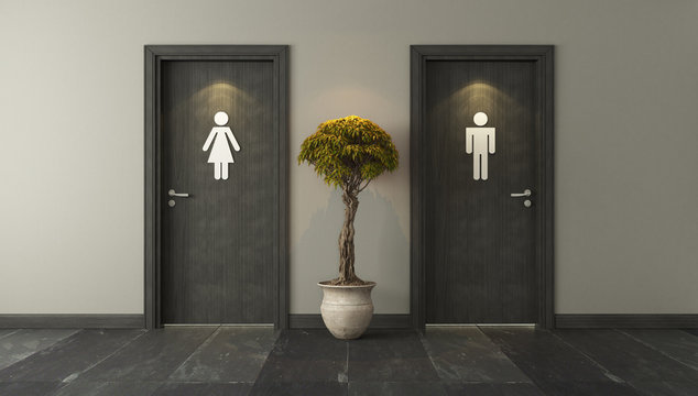 black restroom doors for male and female genders with spot light