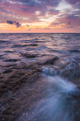 Long exposure sea and rocks at twilight