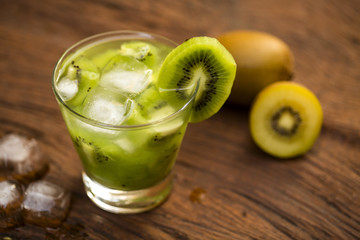 Kiwi Fruit Caipirinha of Brazil on wooden background