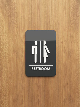 public restroom sign on the wood