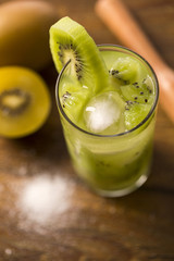 Kiwi Fruit Caipirinha of Brazil on wooden background