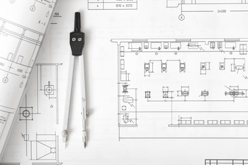 Engineering compass is on building plan.