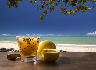 Fresh drink made with passion fruit Caipirinha in the beach back