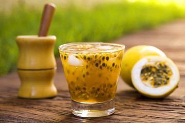 Passion Fruit Caipirinha of Brazil in green blurry background