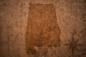 alabama state map on a old vintage crack paper background