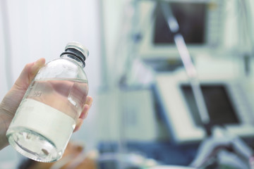 Doctor shows a bottle with a solution