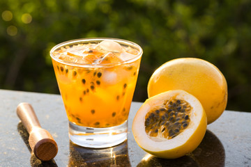 Passion Fruit Caipirinha of Brazil in green blurry background