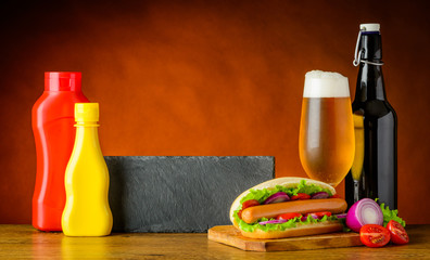 Obraz na płótnie Canvas Fast Food Hot Dog Sandwich with Beer and Copy Space